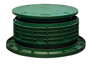 Septic tank riser installed at ground level, providing easy access to the tank lid for maintenance, inspections and pumping.